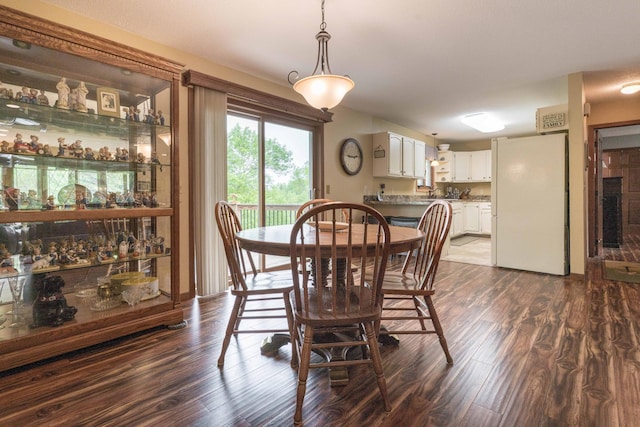 23725 240th Ave, Aurdal Twp, MN 56537 - dining room featuring dark wood finished floors