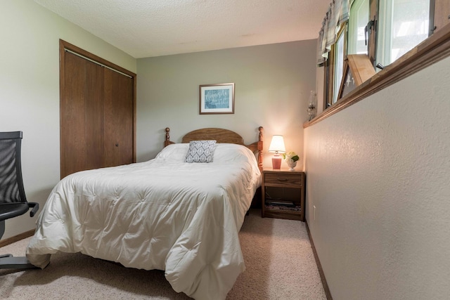 23725 240th Ave, Aurdal Twp, MN 56537 - bedroom with light colored carpet, a closet, and a textured ceiling