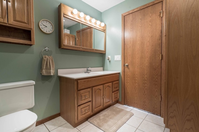 23725 240th Ave, Aurdal Twp, MN 56537 - bathroom with toilet, vanity, tile patterned floors, and baseboards
