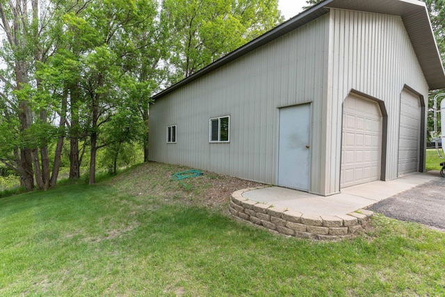 23725 240th Ave, Aurdal Twp, MN 56537 - view of side of property with a yard, a garage, and an outbuilding