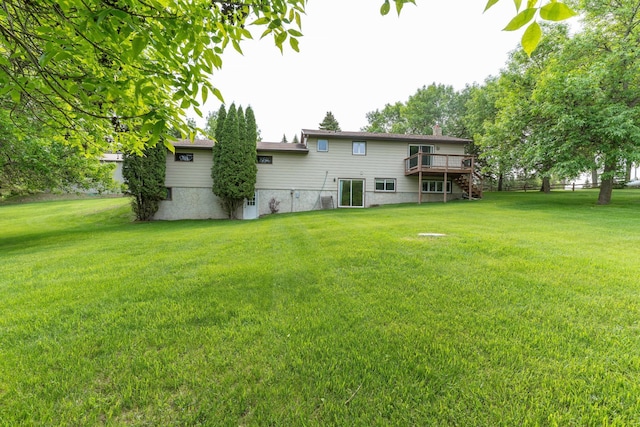 23725 240th Ave, Aurdal Twp, MN 56537 - rear view of property featuring a deck, a lawn, and stairway