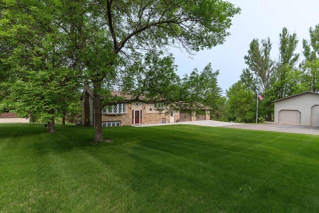 23725 240th Ave, Aurdal Twp, MN 56537 - bi-level home featuring a front lawn, an outbuilding, and a detached garage