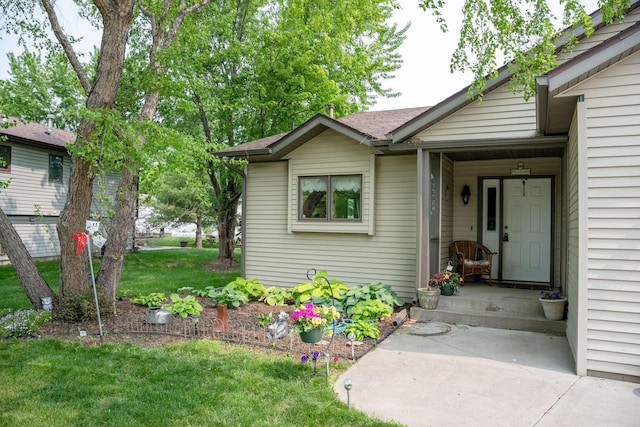 106 4th Ave NW, Rice, MN 56367 - doorway to property with a yard and roof with shingles