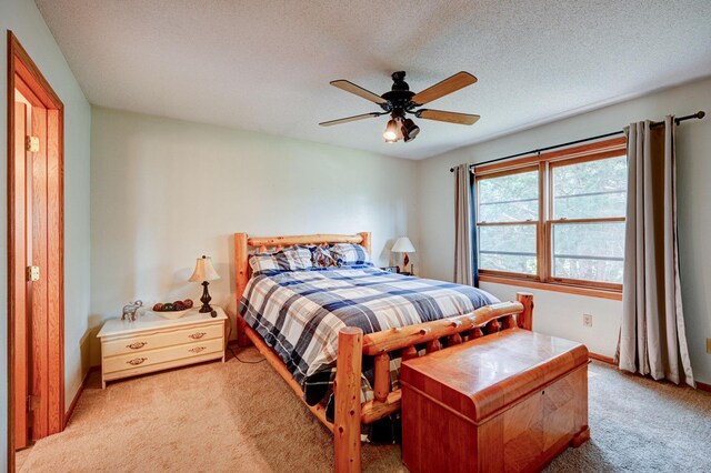106 4th Ave NW, Rice, MN 56367 - bedroom with light carpet, ceiling fan, baseboards, and a textured ceiling