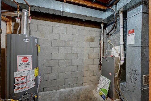 106 4th Ave NW, Rice, MN 56367 - utility room featuring gas water heater
