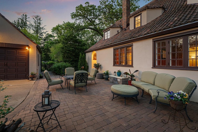 808 4th St SW, Austin, MN 55912 - patio terrace at dusk featuring outdoor lounge area, outdoor dining area, and a patio