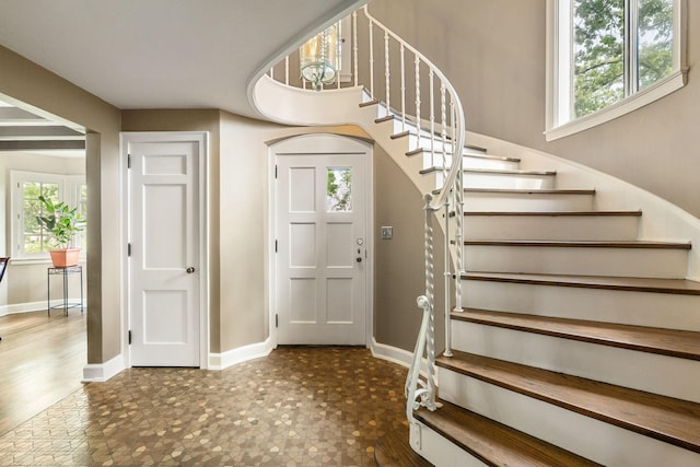 808 4th St SW, Austin, MN 55912 - foyer with stairs and baseboards