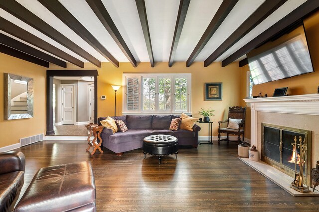 808 4th St SW, Austin, MN 55912 - living area with beam ceiling, a high end fireplace, baseboards, and wood finished floors