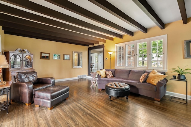 808 4th St SW, Austin, MN 55912 - living room featuring beam ceiling, baseboards, and wood finished floors