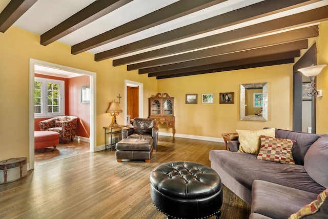 808 4th St SW, Austin, MN 55912 - living room featuring wood finished floors, beamed ceiling, and baseboards