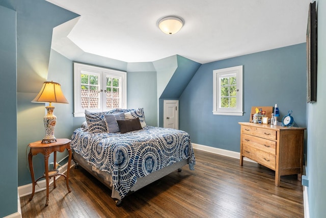 808 4th St SW, Austin, MN 55912 - bedroom featuring baseboards, wood finished floors, and multiple windows