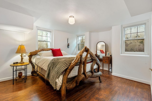 808 4th St SW, Austin, MN 55912 - bedroom featuring wood finished floors and baseboards