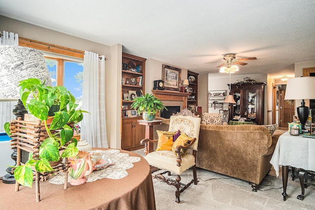 102 Walnut Ave, Luverne, MN 56156 - living area with ceiling fan, a fireplace, light colored carpet, and a textured ceiling