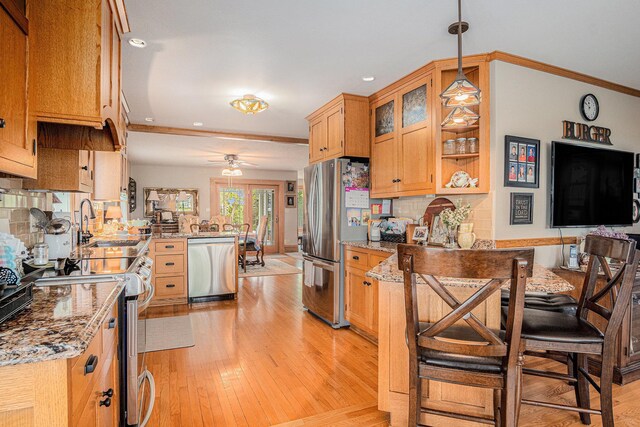 102 Walnut Ave, Luverne, MN 56156 - kitchen with a peninsula, stainless steel appliances, ceiling fan, light wood-style floors, and recessed lighting