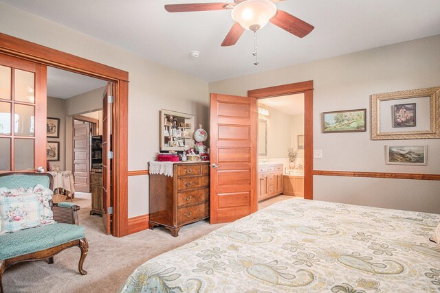 102 Walnut Ave, Luverne, MN 56156 - bedroom with light colored carpet, a ceiling fan, ensuite bathroom, and baseboards