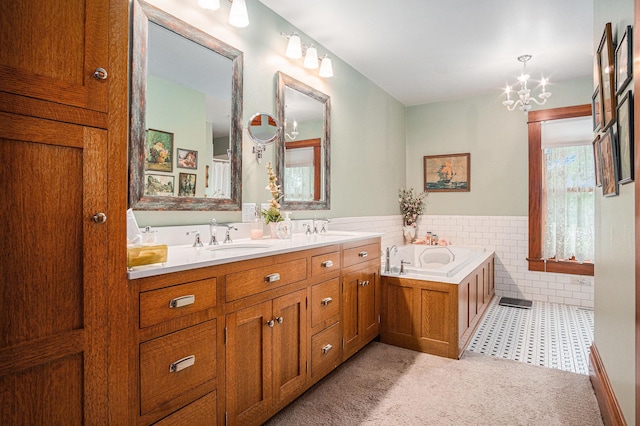 102 Walnut Ave, Luverne, MN 56156 - bathroom with tile walls, double vanity, a wainscoted wall, a garden tub, and a chandelier