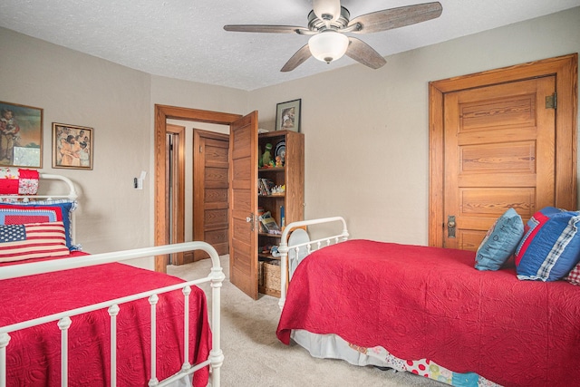 102 Walnut Ave, Luverne, MN 56156 - bedroom featuring carpet flooring, ceiling fan, and a textured ceiling