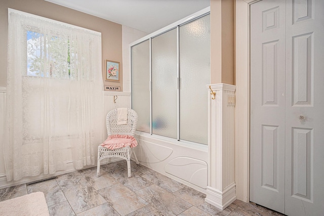 102 Walnut Ave, Luverne, MN 56156 - full bathroom featuring bath / shower combo with glass door and a closet