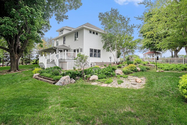 102 Walnut Ave, Luverne, MN 56156 - rear view of property with a deck and stairway