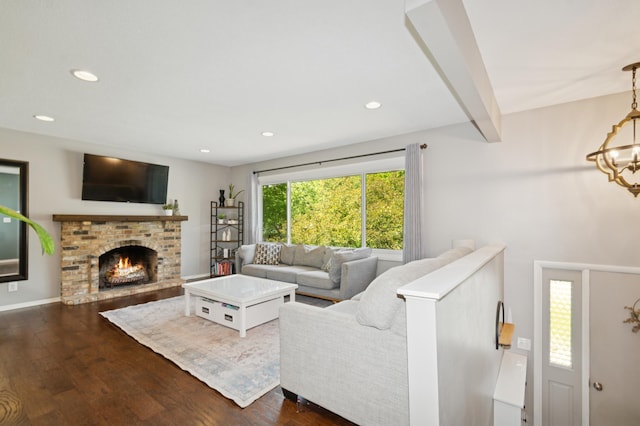 15613 Boulder Creek Dr, Minnetonka, MN 55345 - living area with dark wood finished floors, a chandelier, beamed ceiling, recessed lighting, and a brick fireplace
