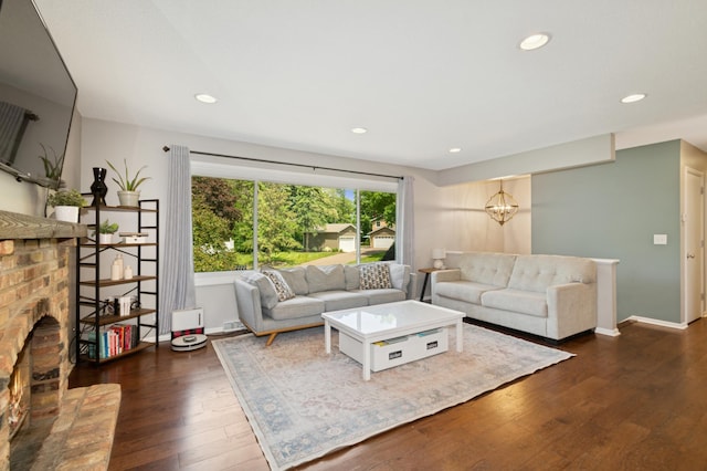 15613 Boulder Creek Dr, Minnetonka, MN 55345 - living area with dark wood-type flooring, recessed lighting, a fireplace, baseboards, and a chandelier