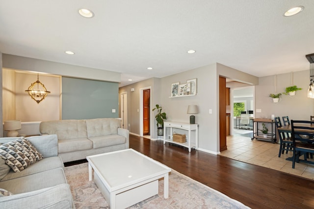 15613 Boulder Creek Dr, Minnetonka, MN 55345 - living area with a chandelier, wood finished floors, recessed lighting, and baseboards
