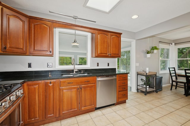 15613 Boulder Creek Dr, Minnetonka, MN 55345 - kitchen featuring stainless steel appliances, a sink, plenty of natural light, light tile patterned flooring, and recessed lighting