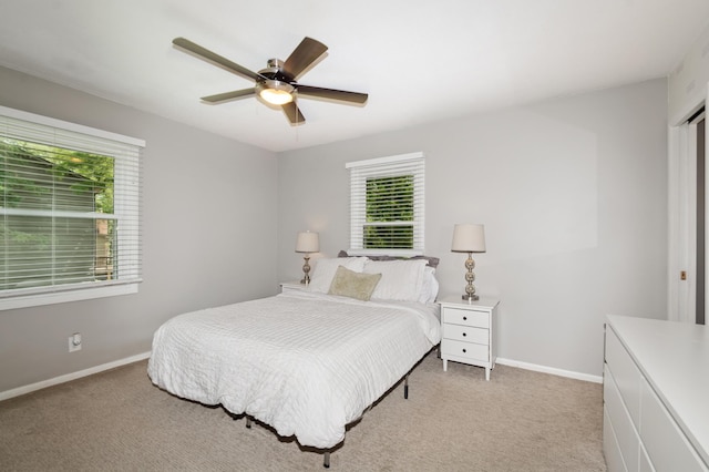 15613 Boulder Creek Dr, Minnetonka, MN 55345 - bedroom featuring multiple windows, light colored carpet, and baseboards