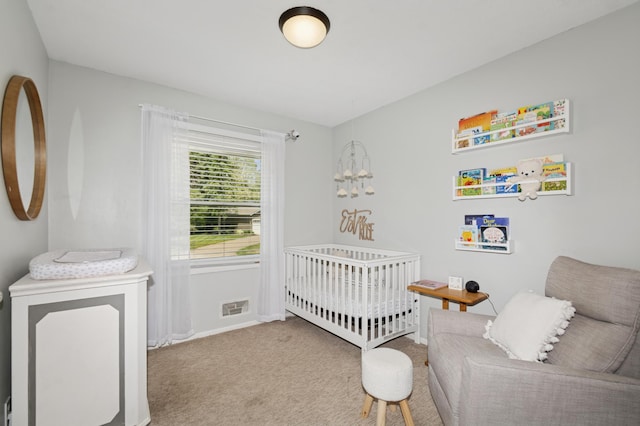 15613 Boulder Creek Dr, Minnetonka, MN 55345 - bedroom with a nursery area, carpet floors, and baseboards