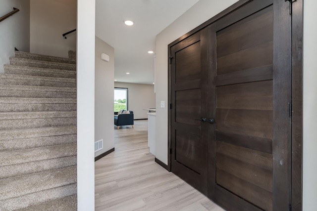 3203 Scotch Ln, Mankato, MN 56001 - entryway featuring light wood-type flooring, stairway, recessed lighting, and baseboards