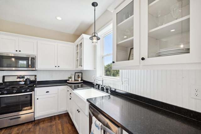 13985 120th St N, Stillwater, MN 55082 - kitchen with stainless steel appliances, a sink, dark countertops, and white cabinets