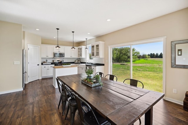 13985 120th St N, Stillwater, MN 55082 - dining space featuring dark wood-style flooring, baseboards, and recessed lighting