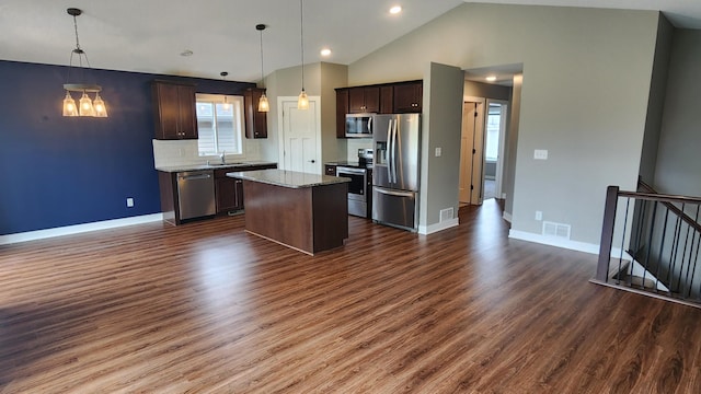 5687 Prosper Ave NW, Rochester, MN 55901 - kitchen with appliances with stainless steel finishes, a sink, dark wood finished floors, a center island, and dark brown cabinets