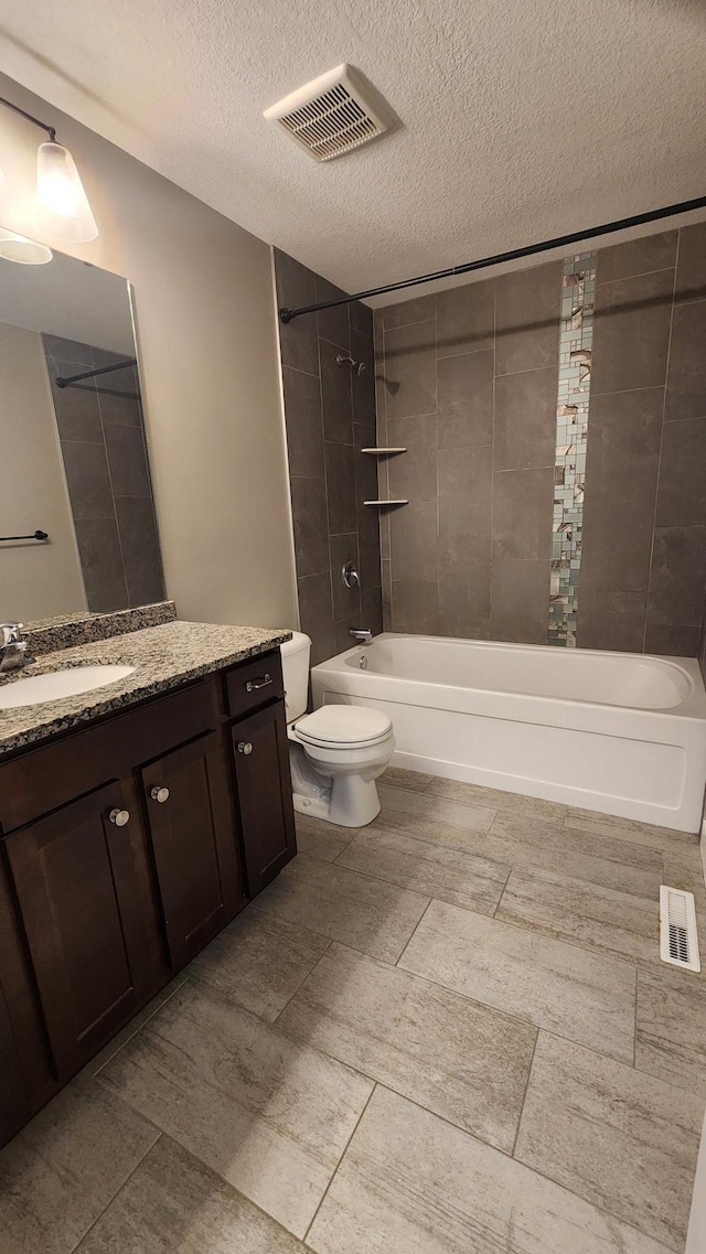 5687 Prosper Ave NW, Rochester, MN 55901 - bathroom with a textured ceiling, vanity, shower / bathtub combination, and toilet