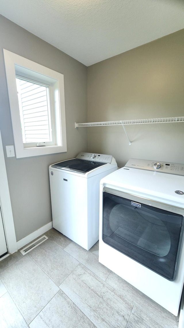 5687 Prosper Ave NW, Rochester, MN 55901 - laundry area featuring independent washer and dryer and baseboards
