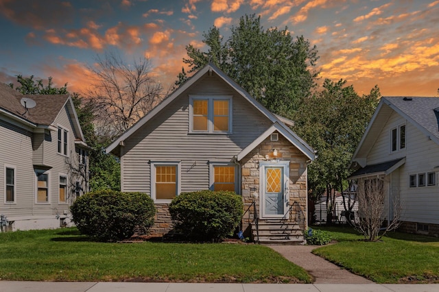 1195 Minnehaha Ave E, Saint Paul, MN 55106 - view of front of house featuring stone siding and a front yard