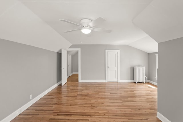 1195 Minnehaha Ave E, Saint Paul, MN 55106 - bonus room featuring radiator heating unit, vaulted ceiling, light wood finished floors, ceiling fan, and baseboards