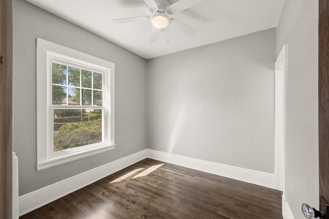 1195 Minnehaha Ave E, Saint Paul, MN 55106 - unfurnished room with baseboards, dark wood-style floors, and a ceiling fan