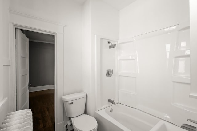 1195 Minnehaha Ave E, Saint Paul, MN 55106 - bathroom with toilet, shower / tub combination, and wood finished floors