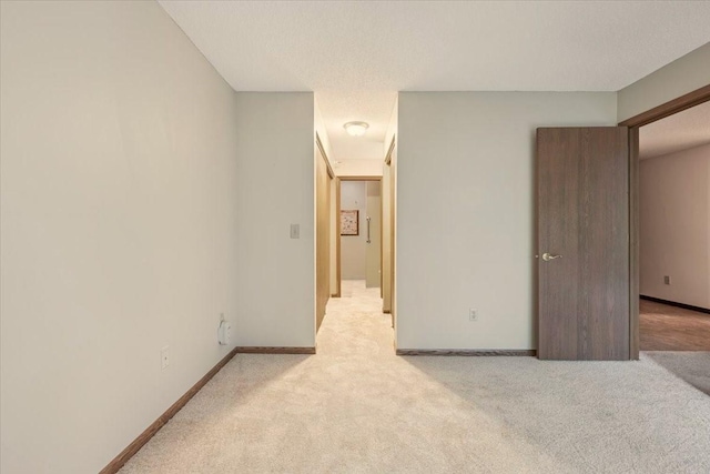 5645 Green Circle Dr Unit 210, Minnetonka, MN 55343 - unfurnished bedroom with light colored carpet and baseboards