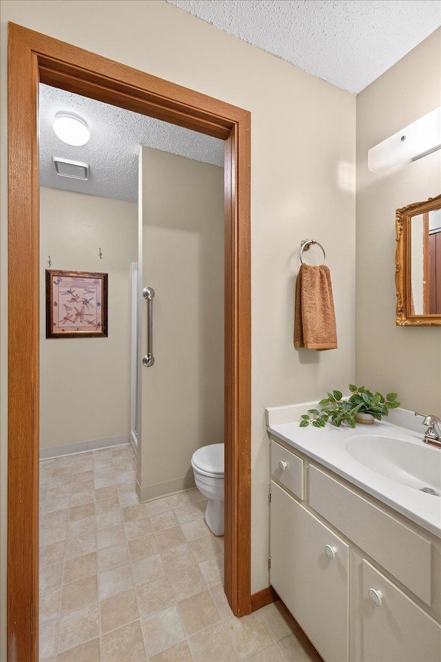 5645 Green Circle Dr Unit 210, Minnetonka, MN 55343 - bathroom with a textured ceiling and vanity