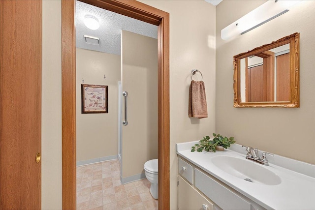 5645 Green Circle Dr Unit 210, Minnetonka, MN 55343 - bathroom featuring vanity, a shower, and a textured ceiling