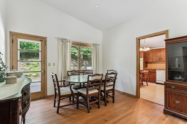 15812 Woodgate Rd N, Minnetonka, MN 55345 - dining room featuring a chandelier, light wood finished floors, high vaulted ceiling, and baseboards