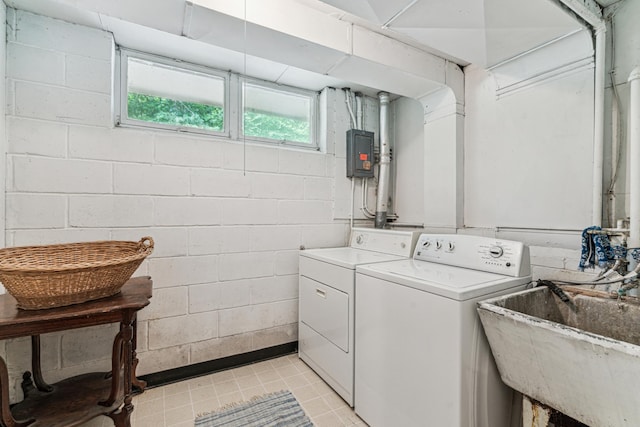 15812 Woodgate Rd N, Minnetonka, MN 55345 - laundry room with washing machine and dryer, concrete block wall, electric panel, and light tile patterned flooring