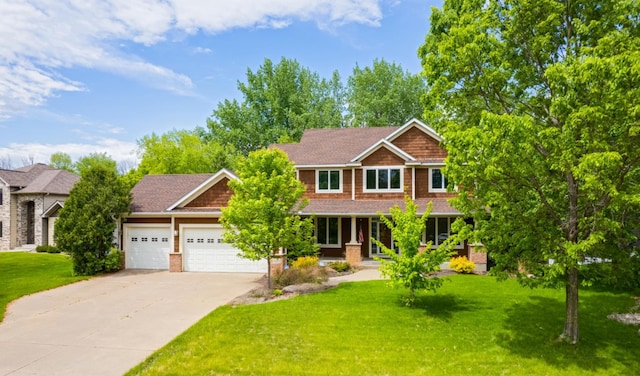 1469 Sherman Lake Rd, Lino Lakes, MN 55038 - craftsman house with a garage, concrete driveway, a front lawn, and a porch