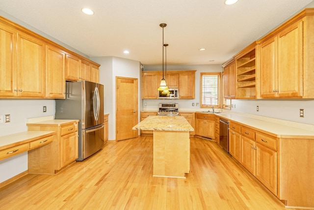 1469 Sherman Lake Rd, Lino Lakes, MN 55038 - kitchen featuring stainless steel appliances, a sink, a center island, open shelves, and light wood-style flooring