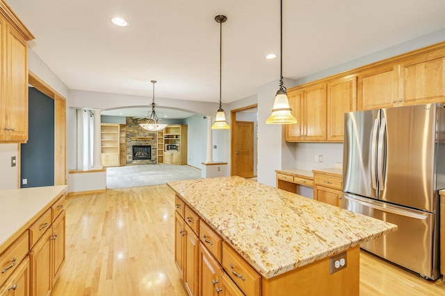 1469 Sherman Lake Rd, Lino Lakes, MN 55038 - kitchen featuring freestanding refrigerator, light wood-type flooring, a kitchen island, decorative light fixtures, and recessed lighting