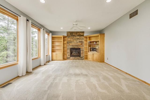 1469 Sherman Lake Rd, Lino Lakes, MN 55038 - unfurnished living room featuring ceiling fan, baseboards, healthy amount of natural light, carpet flooring, and recessed lighting