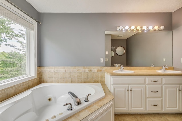 1469 Sherman Lake Rd, Lino Lakes, MN 55038 - bathroom with healthy amount of natural light, double vanity, a whirlpool tub, and tile patterned flooring