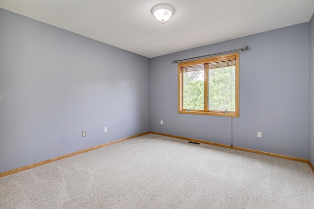 1469 Sherman Lake Rd, Lino Lakes, MN 55038 - empty room with light colored carpet, baseboards, and a textured ceiling
